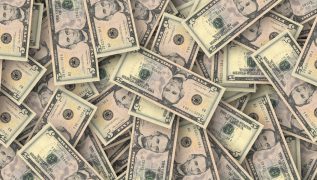 Zdjęcie przedstawiające znak banknoty dolara o różnej nominacji